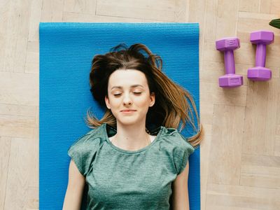 View of an empty serene room with a yoga mat.